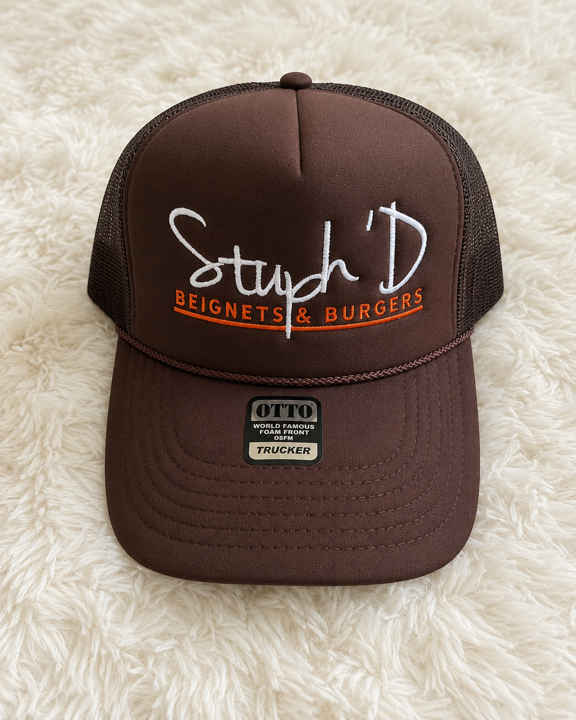 Stuph 'D Beignets & Burgers brown Otto trucker hat with white and orange embroidered logo